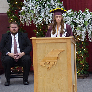 Valedictorian Kailey Johnson (faculty-selected speaker) gives a student commencement address